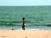 Tourist strolling on beach