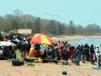 Villagers gather at beach